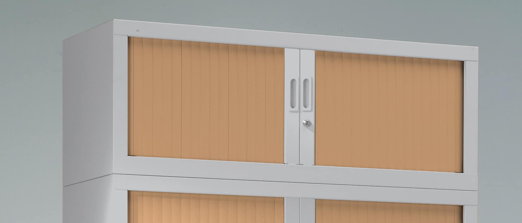 Two-tone metal riser for tambour door cabinet